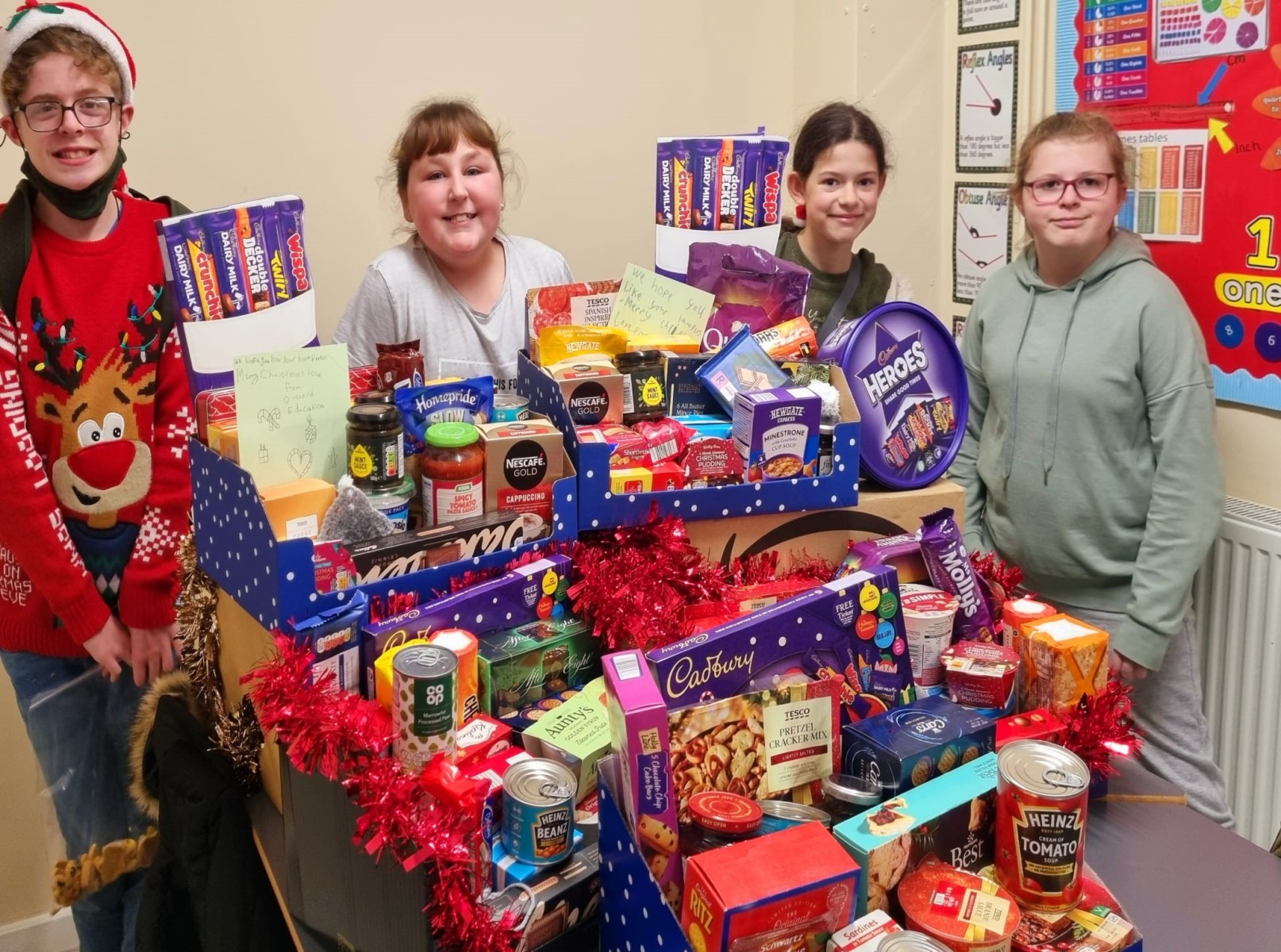 Pupils from the Laceby Road site of Orchard Education Special Educational Needs school in Grimsby collecting and delivering Harvest festival hampers in their local community.