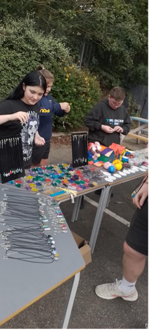 Learner from the Laceby Road site of The Orchard Special Educational Needs school, running a stall raising money for local charities as part of their enterprise day.